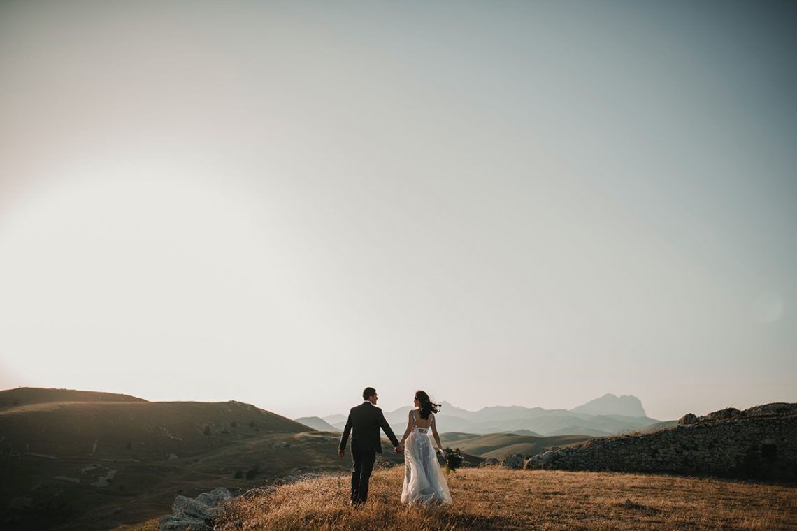 Wedding couple on a hill